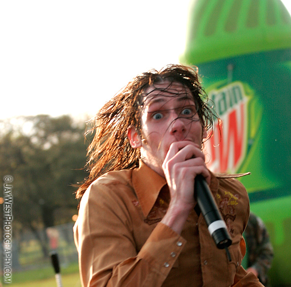 Mike Wiebe of The Riverboat Gamblers rushes back to stage after a bottle of